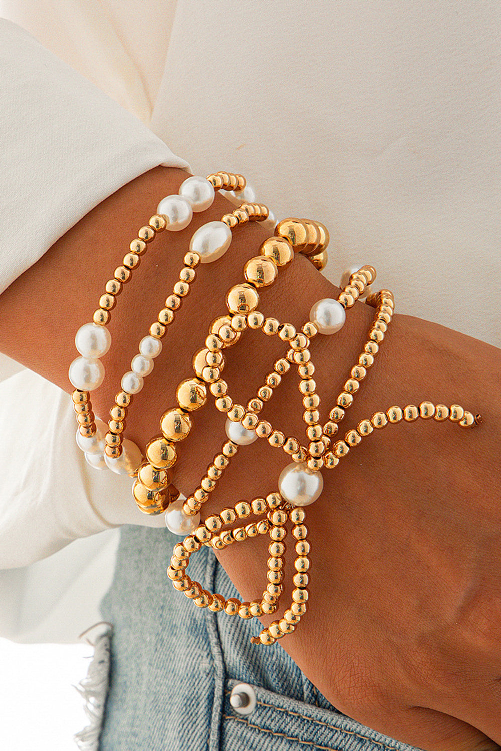 Set di Bracciali Multistrato con Fiocco Dorato e Perle