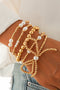 Set di Bracciali Multistrato con Fiocco Dorato e Perle