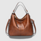 Sac à bandoulière en cuir, spacieux et chic, avec bandoulière réglable