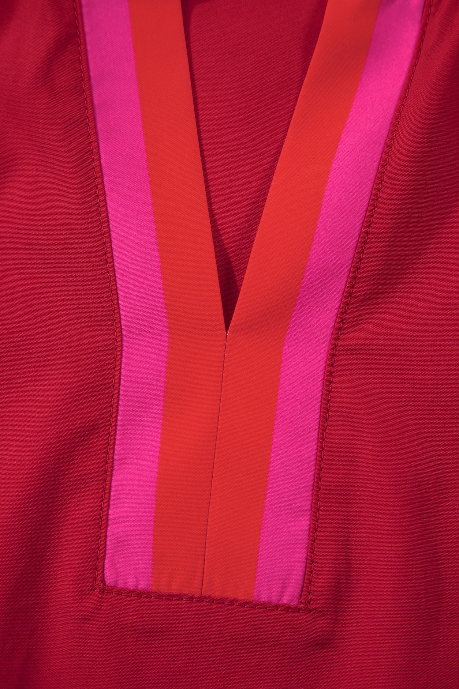 Flame-red striped blouse with a ruffled collar and short puff sleeves